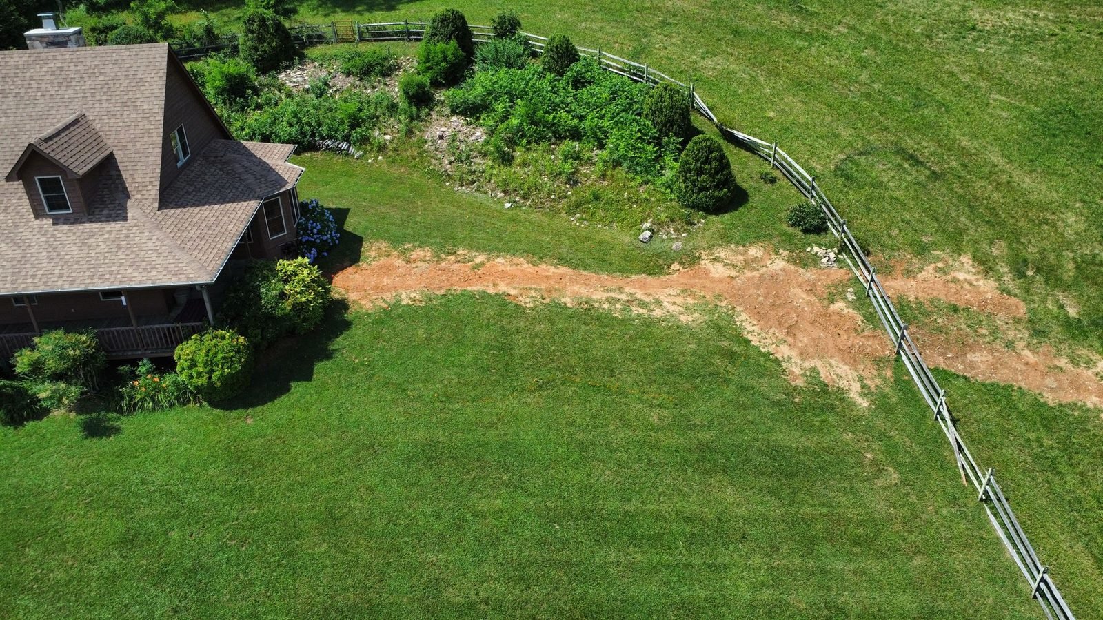 Bare backyard before hardscape construction at mountain home Western NC
