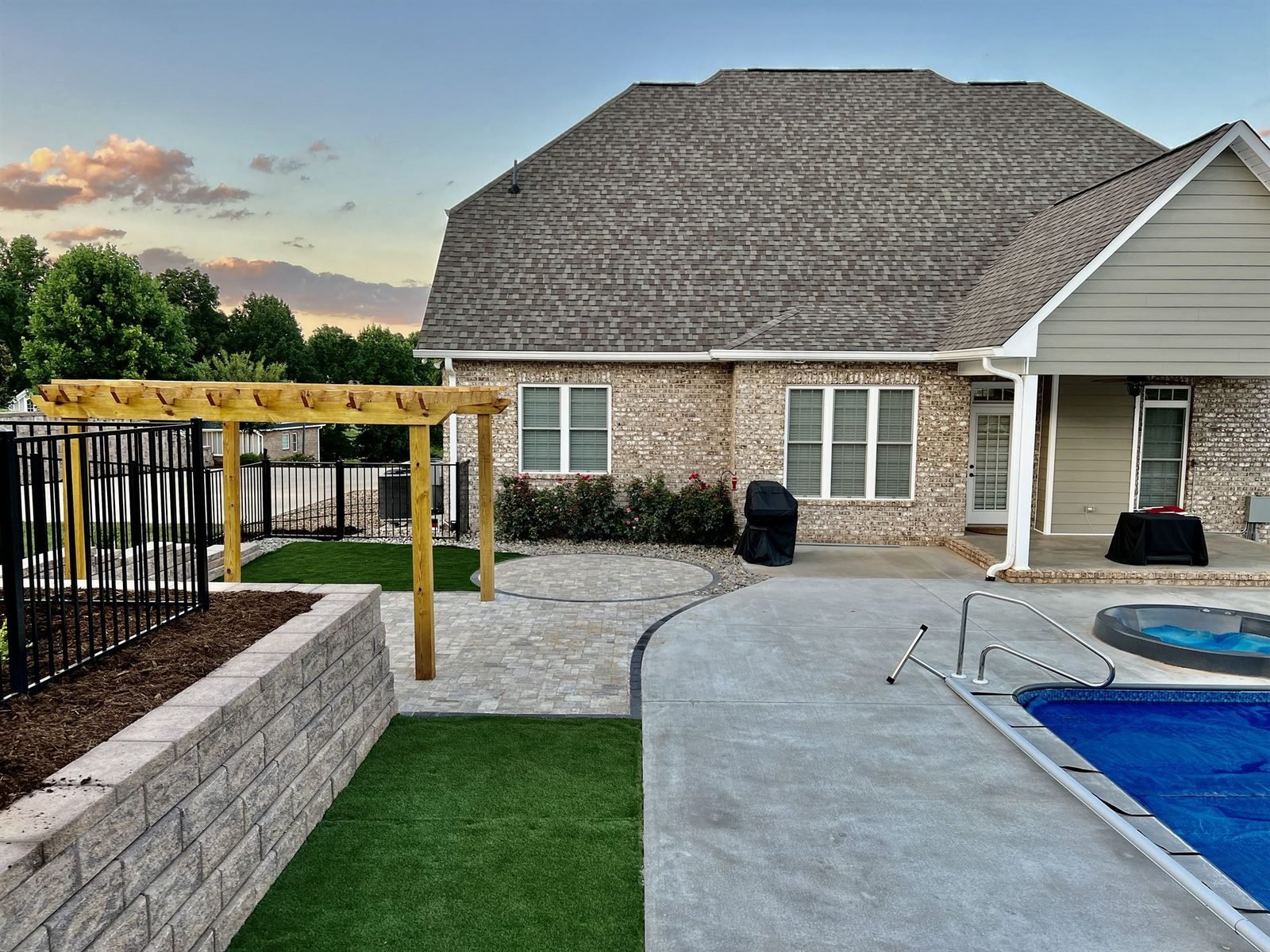 Pergola, patio, pool and retaining wall at dusk Western NC